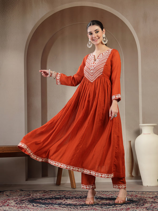 Kimayra Cotton Calf Length Solid 3/4 Sleeve Round Neck Flared Kurta Suit Set